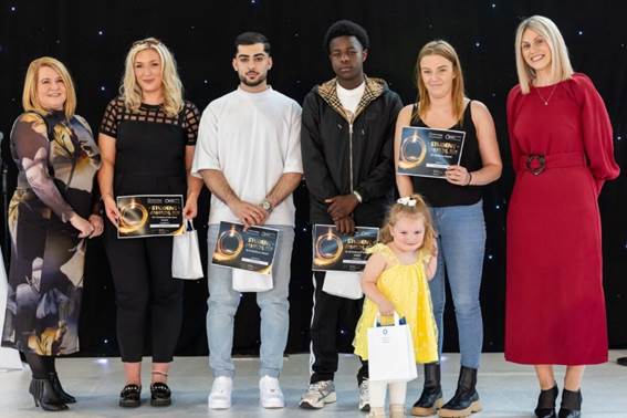 Award winners holding certificates