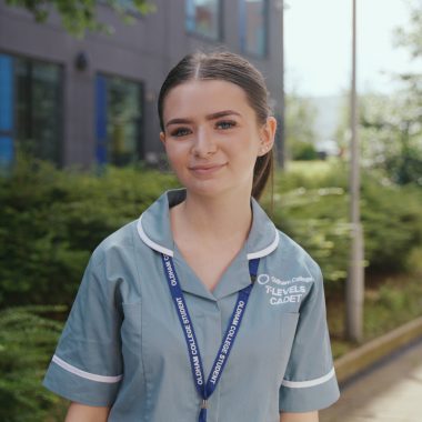 Female MidwiferyT Level college student standing outside in uniform