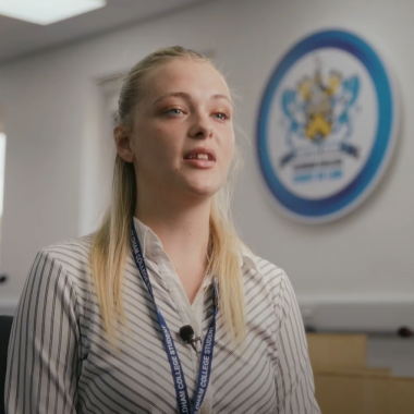Female paralegal apprentice in mock courtroom classroom