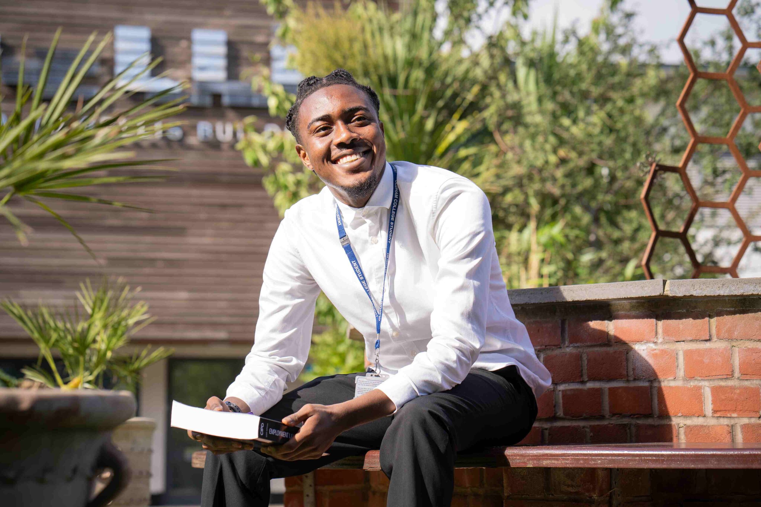 Young college student sat down outside