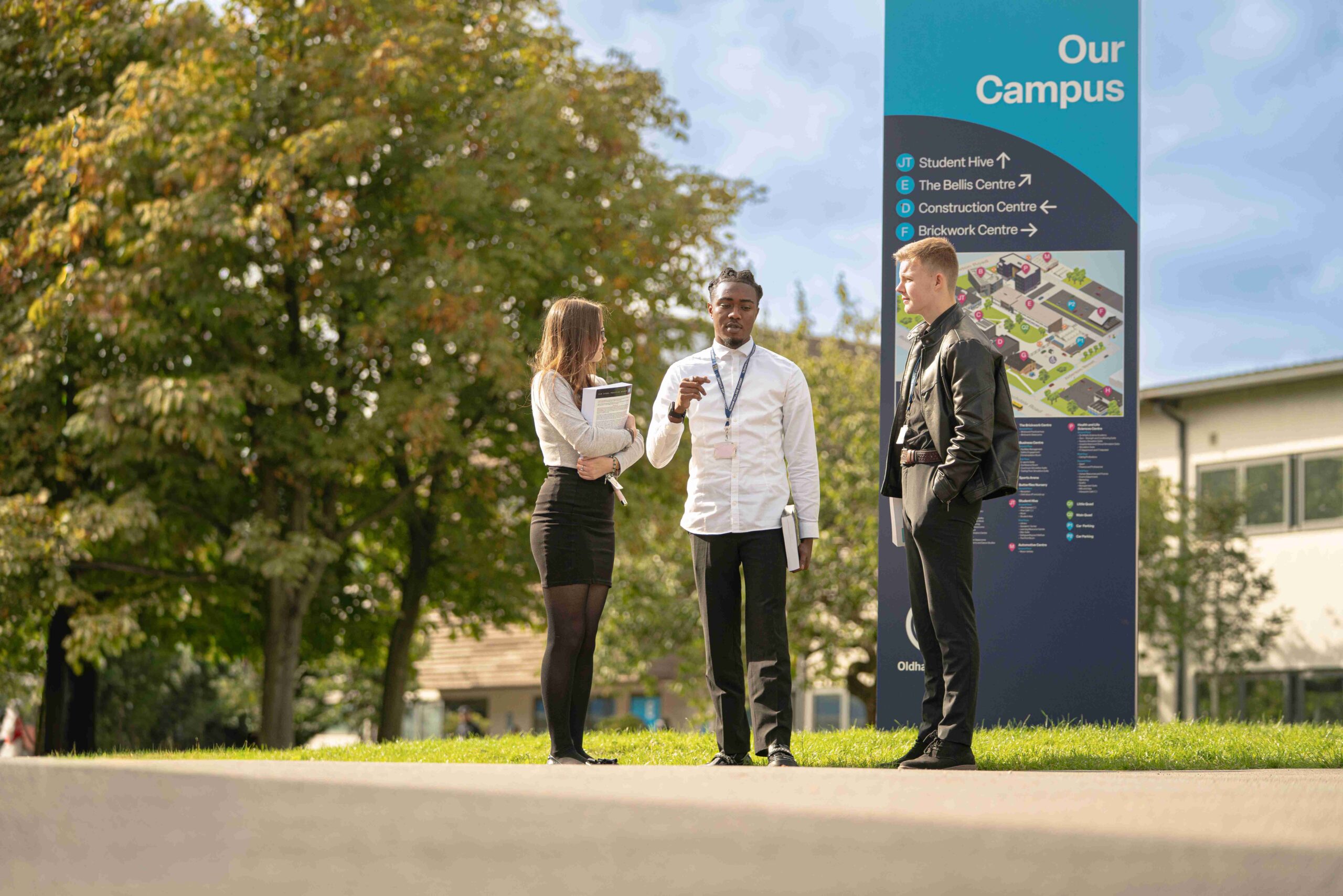 Group of three college students outside on campus
