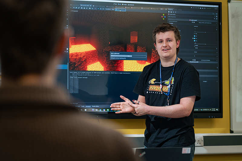 Male digital college student delivering a presentation on screen