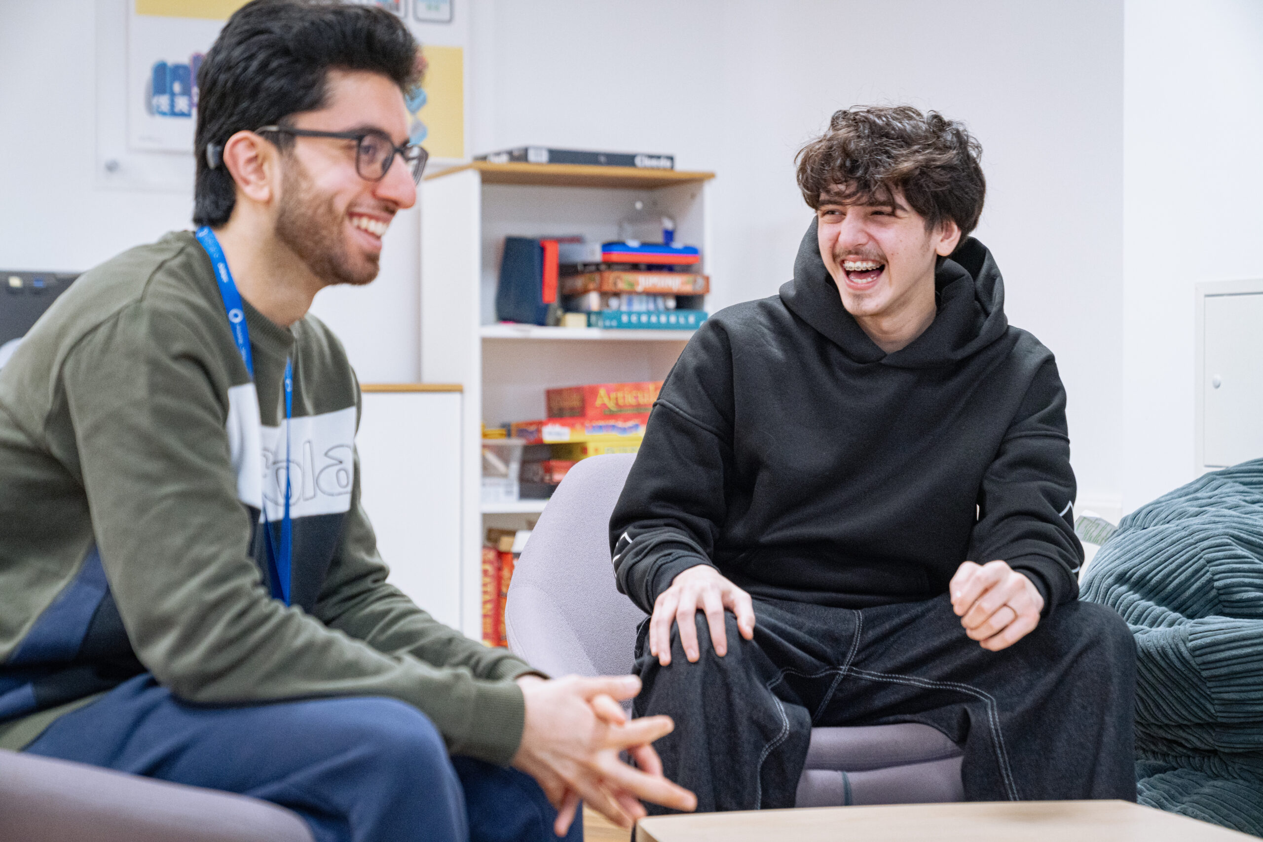 student laughing with a tutor
