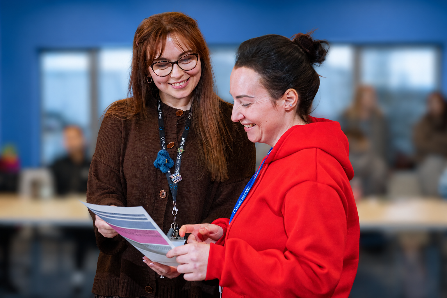 Two female university students looking at a document